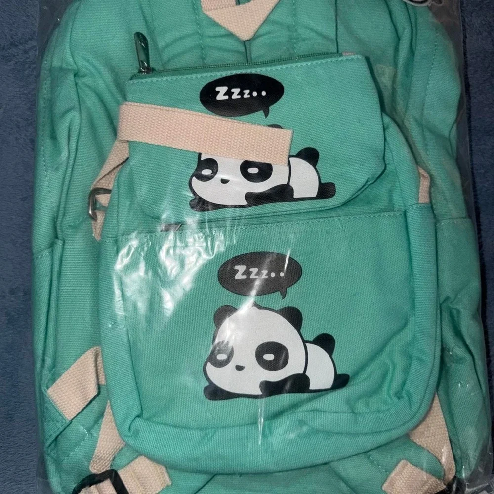 Green backpack with white panda graphics